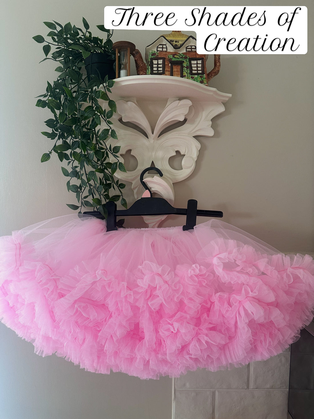 Pink fluffy ruffle tutu skirt on a hanger