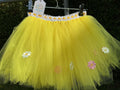 Yellow tutu skirt with mixed flower embellishments