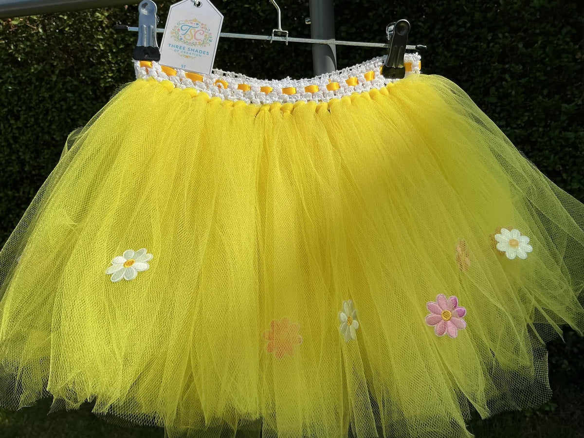 Yellow tutu skirt with mixed flower embellishments