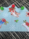 Pale blue fabric Christmas crown with ice skates, snowflakes and colourful pom-poms