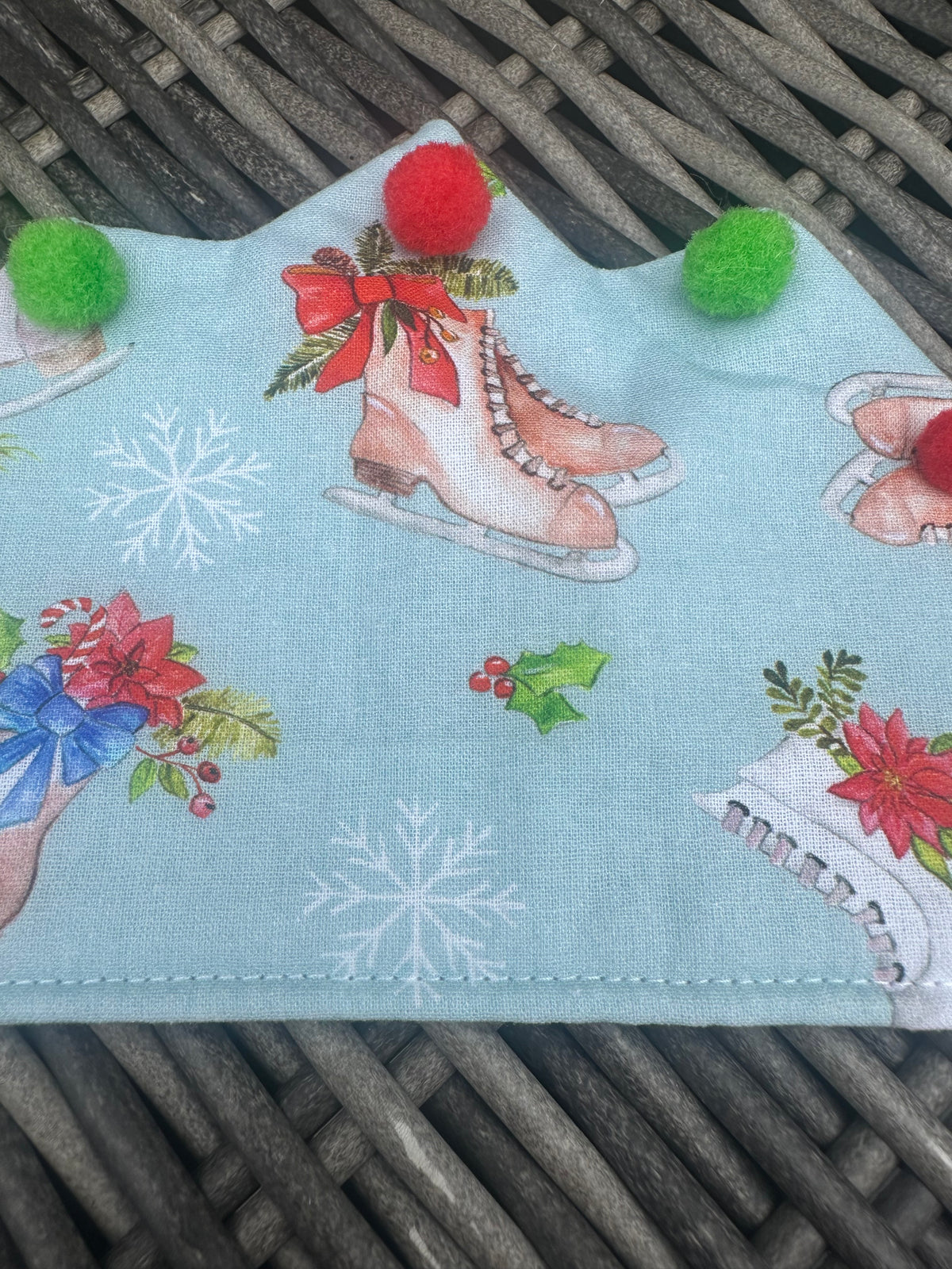 Pale blue fabric Christmas crown with ice skates, snowflakes and colourful pom-poms