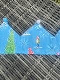 Blue fabric crown with winter skaters, Christmas tree, snowflakes and blue and white pom-poms
