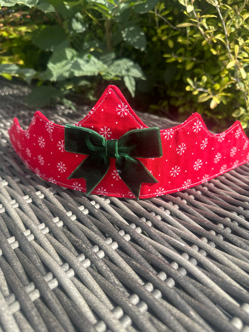 Red snowflake fabric crown with dark green velvet bow