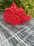 Bright red Christmas crown with gold snowflake, star and winter decoration print