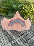 Blush pink felt crown with sparkling multicoloured rhinestone rainbow design and floral bow