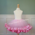 Pink lace and satin-trim tutu skirt on a mannequin