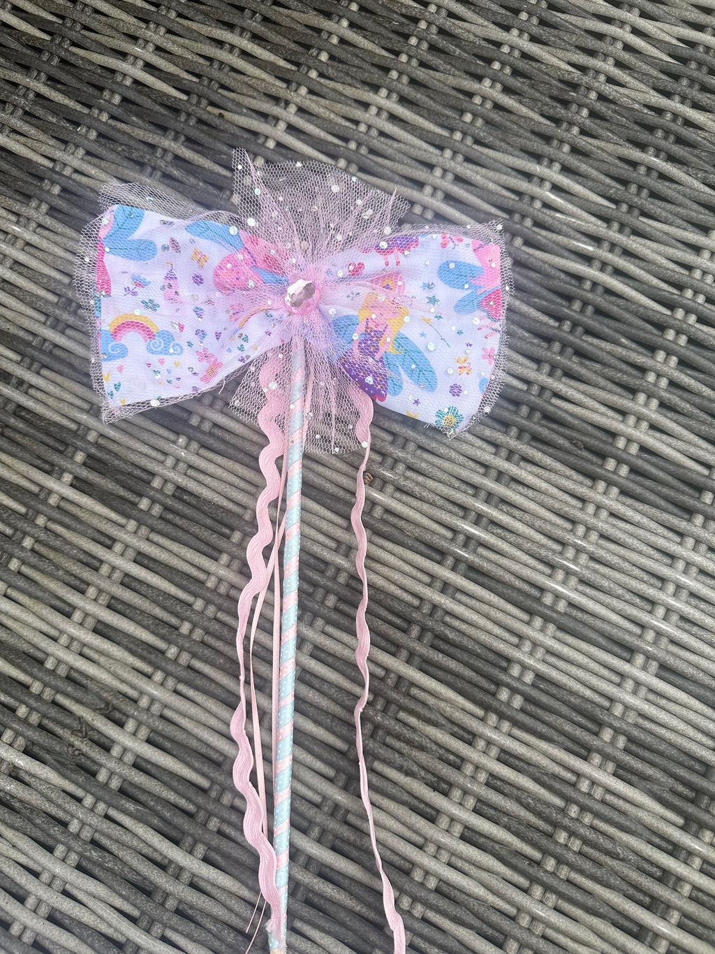 Close-up of the matching pastel mermaid fairy wand with pink tulle bow