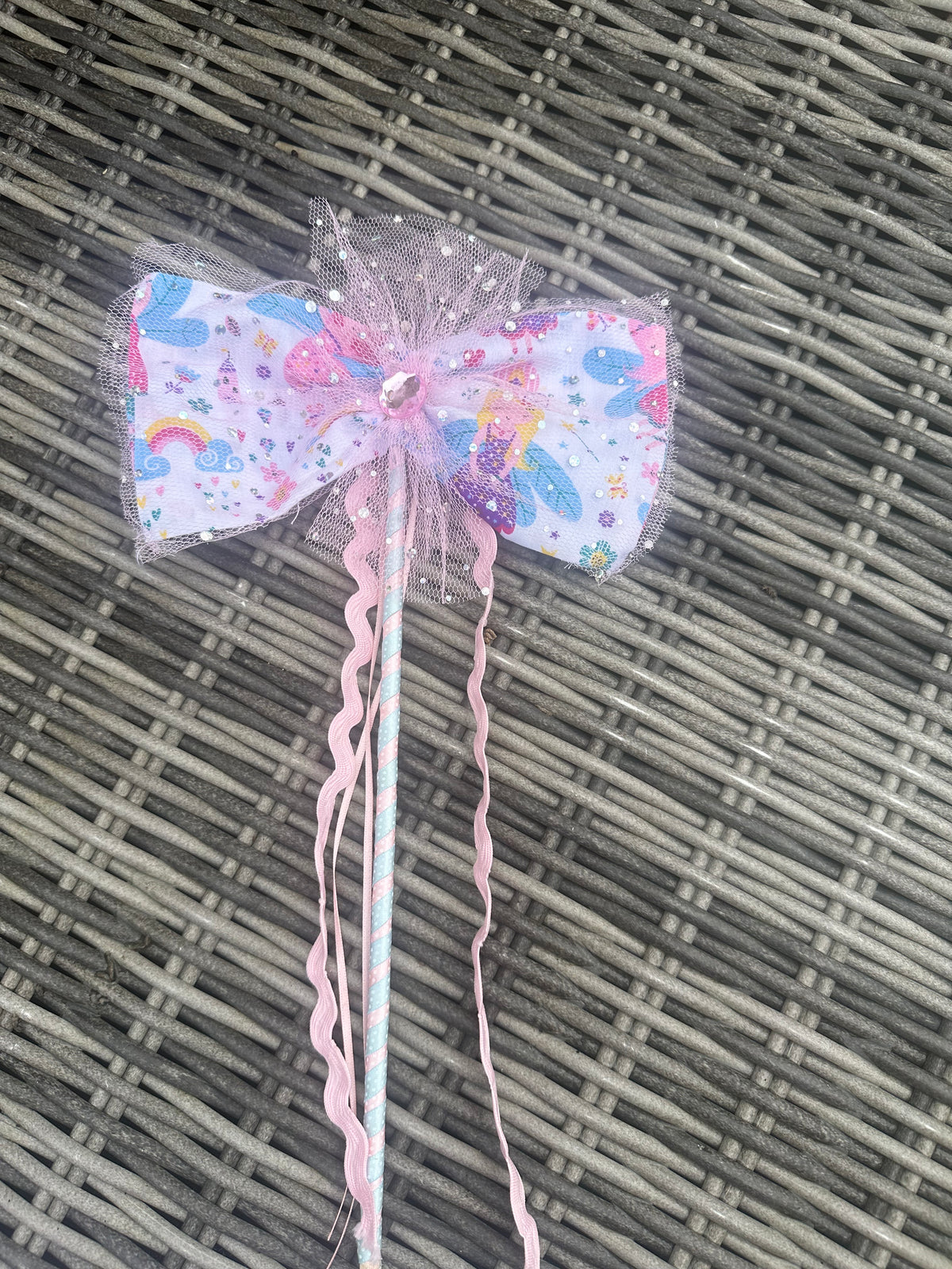 Close-up of the matching pastel mermaid fairy wand with pink tulle bow