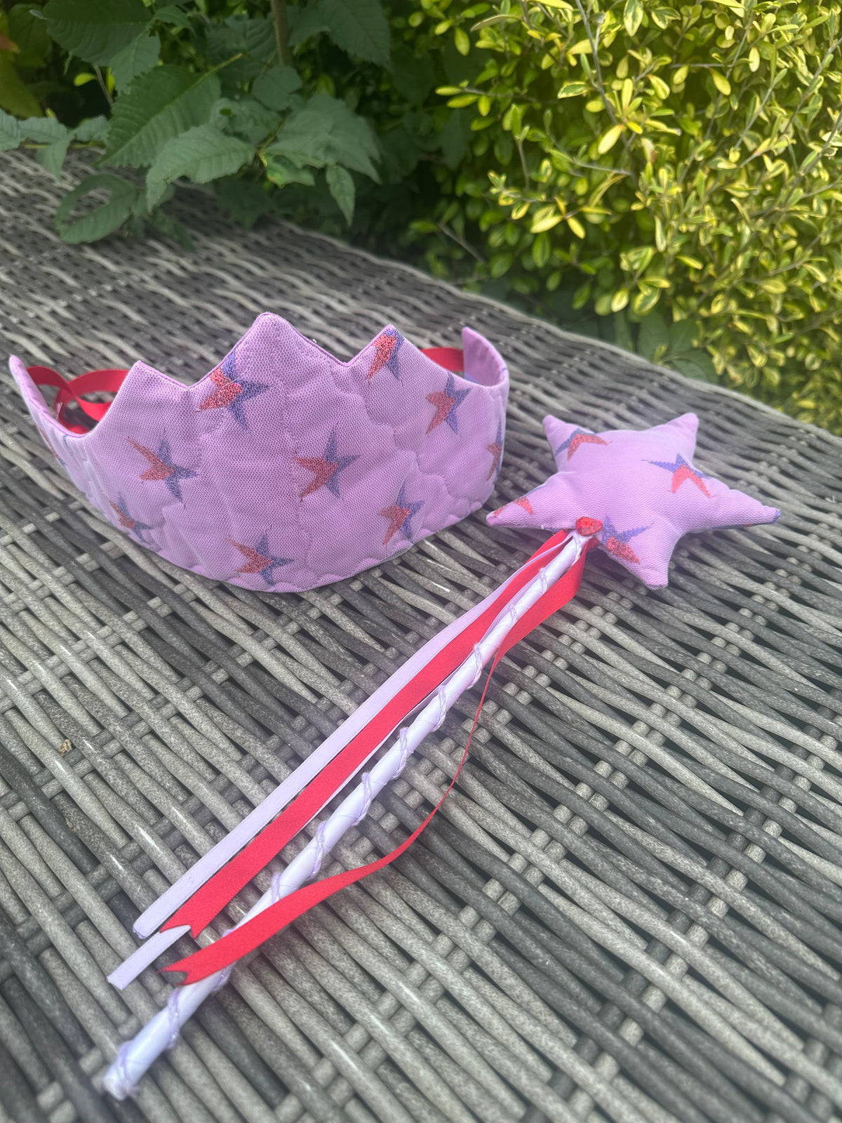 Lilac star-print crown and matching star wand displayed together