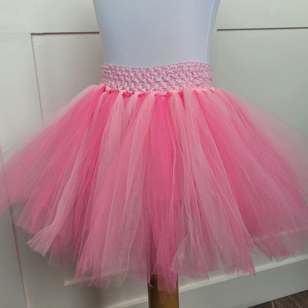 Pink layered tulle tutu skirt with shimmering crochet waistband, front close view
