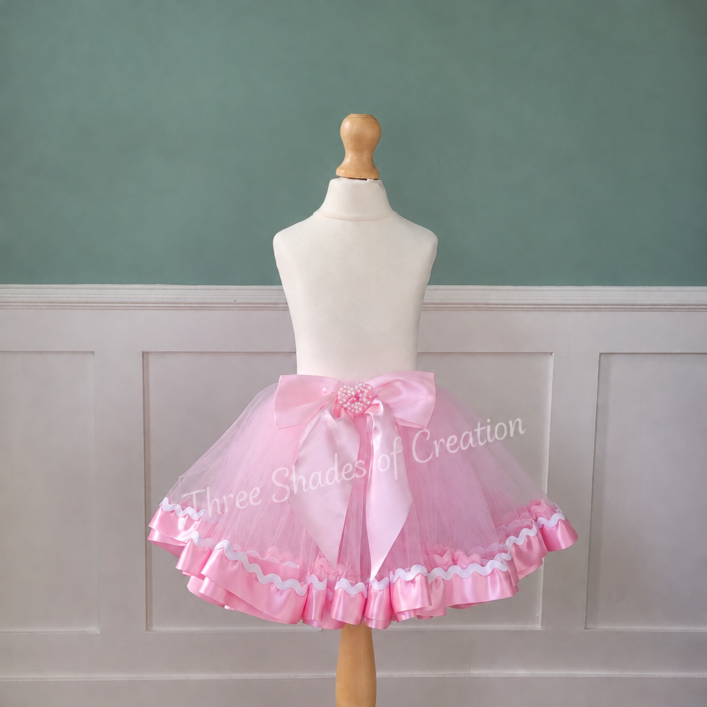 Pink ric-rac tutu with corner logo removed