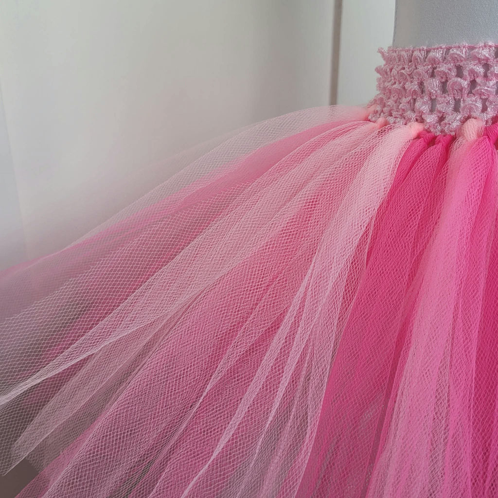 Close-up of pale and bright pink tulle layers and crochet waistband