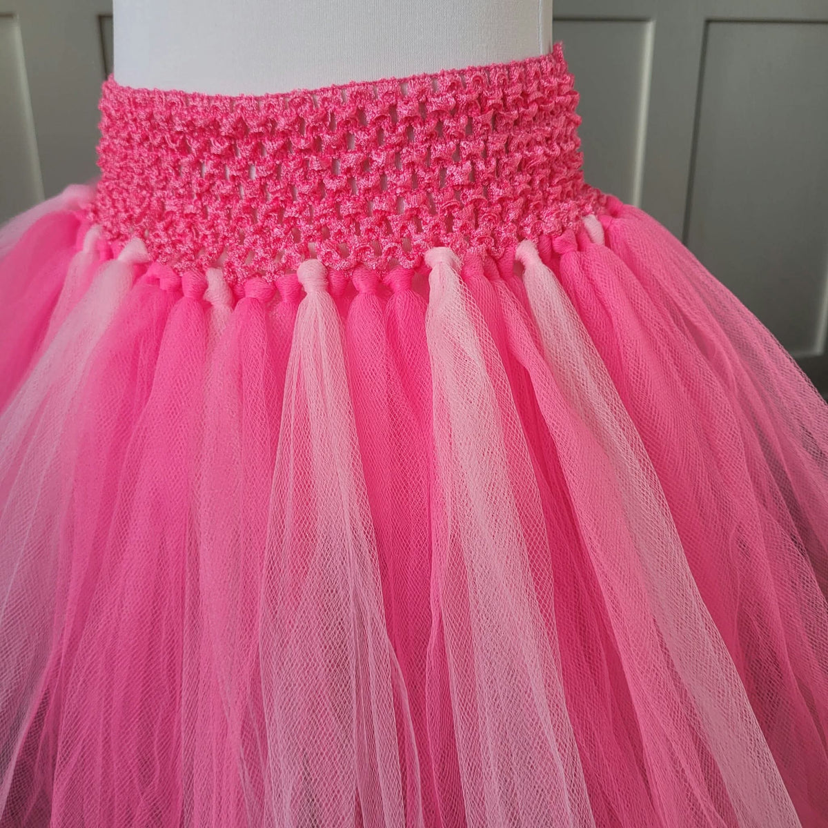 Close-up of pink crochet waistband and two-tone pink tulle layers