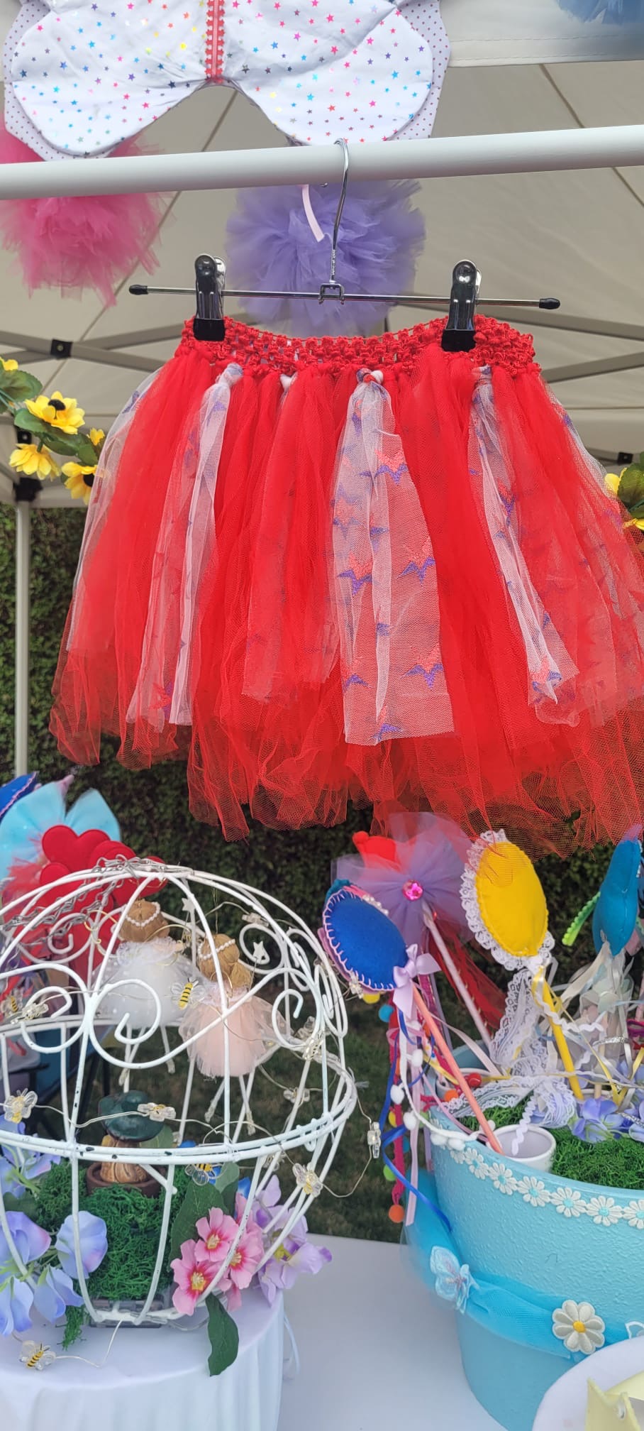 Red tutu skirt with star-print ribbon strips on display