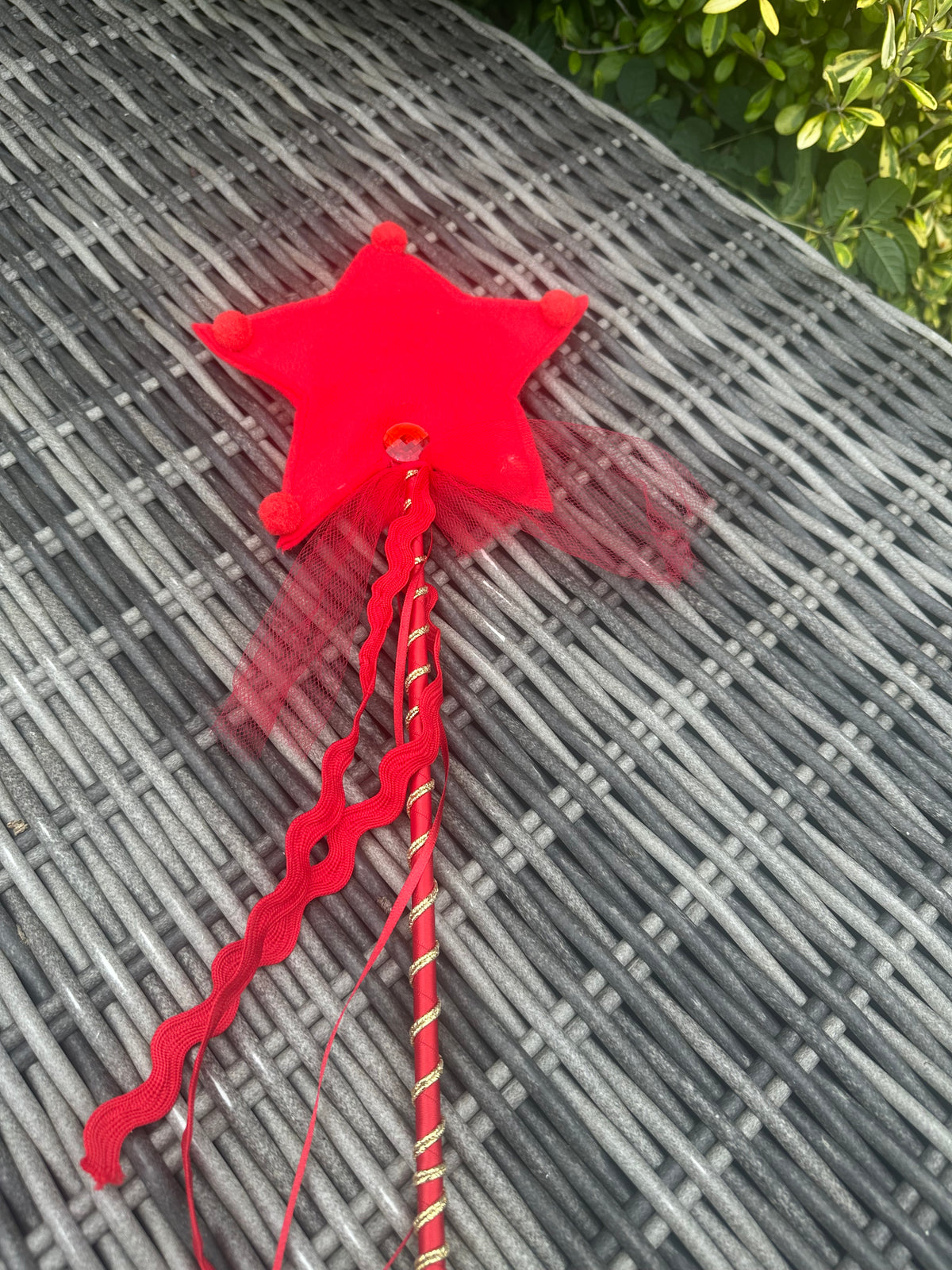 Red star wand with gold trim, red ribbon and sheer tulle streamers