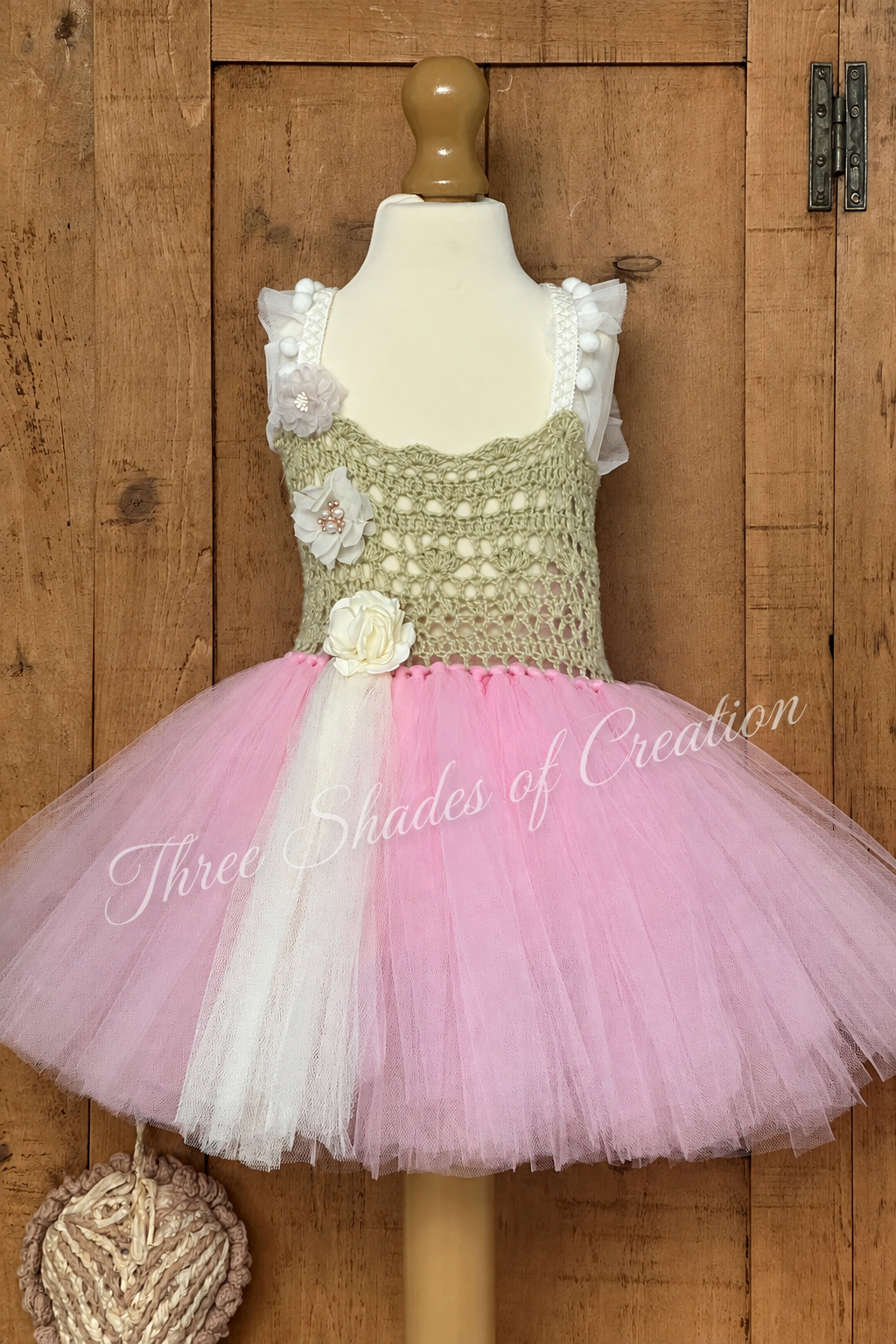 Sage green crochet tutu dress with pink and cream tulle and Three Shades of Creation text watermark