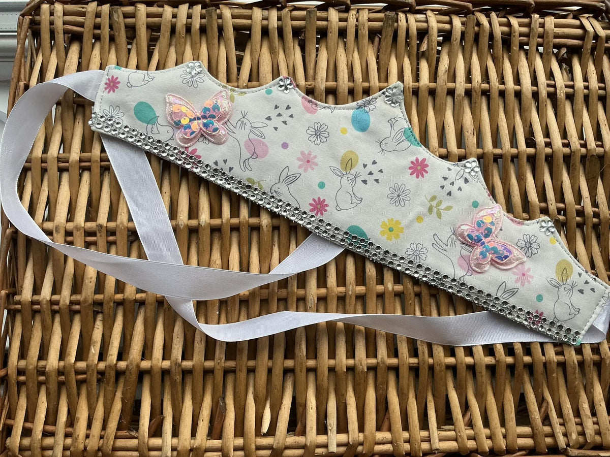 Handmade white bunny print fabric crown with pink sequin butterfly appliqués, crystal gems and silver rhinestone trim