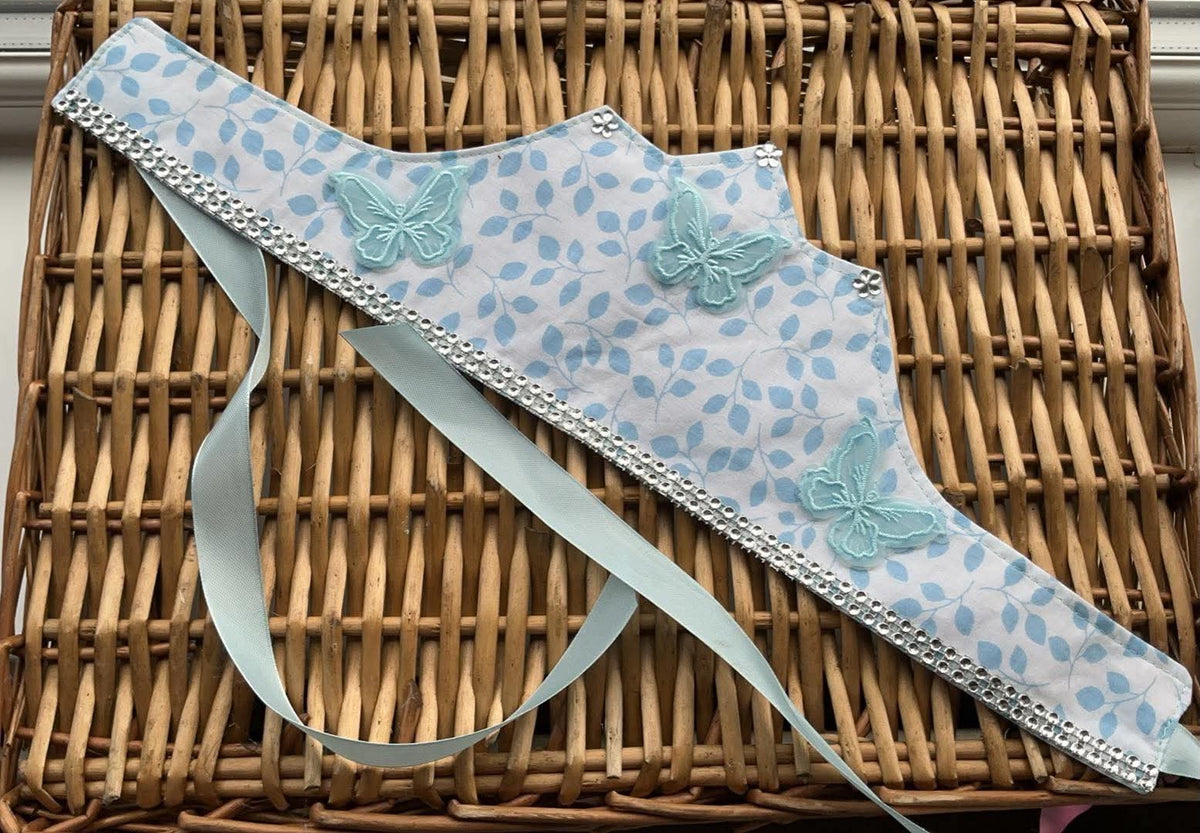 Handmade pale blue leaf print fabric crown with 3D embroidered butterfly appliqués, daisy gem accents and silver rhinestone trim