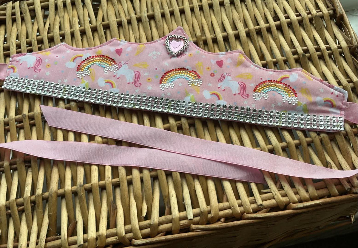 Handmade pink unicorn rainbow fabric crown with hand-placed rhinestone rainbows, silver heart charm and rhinestone trim