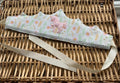 Handmade white floral fabric crown with pink glitter unicorn appliqué, silver rhinestone trim and cream satin ribbon ties