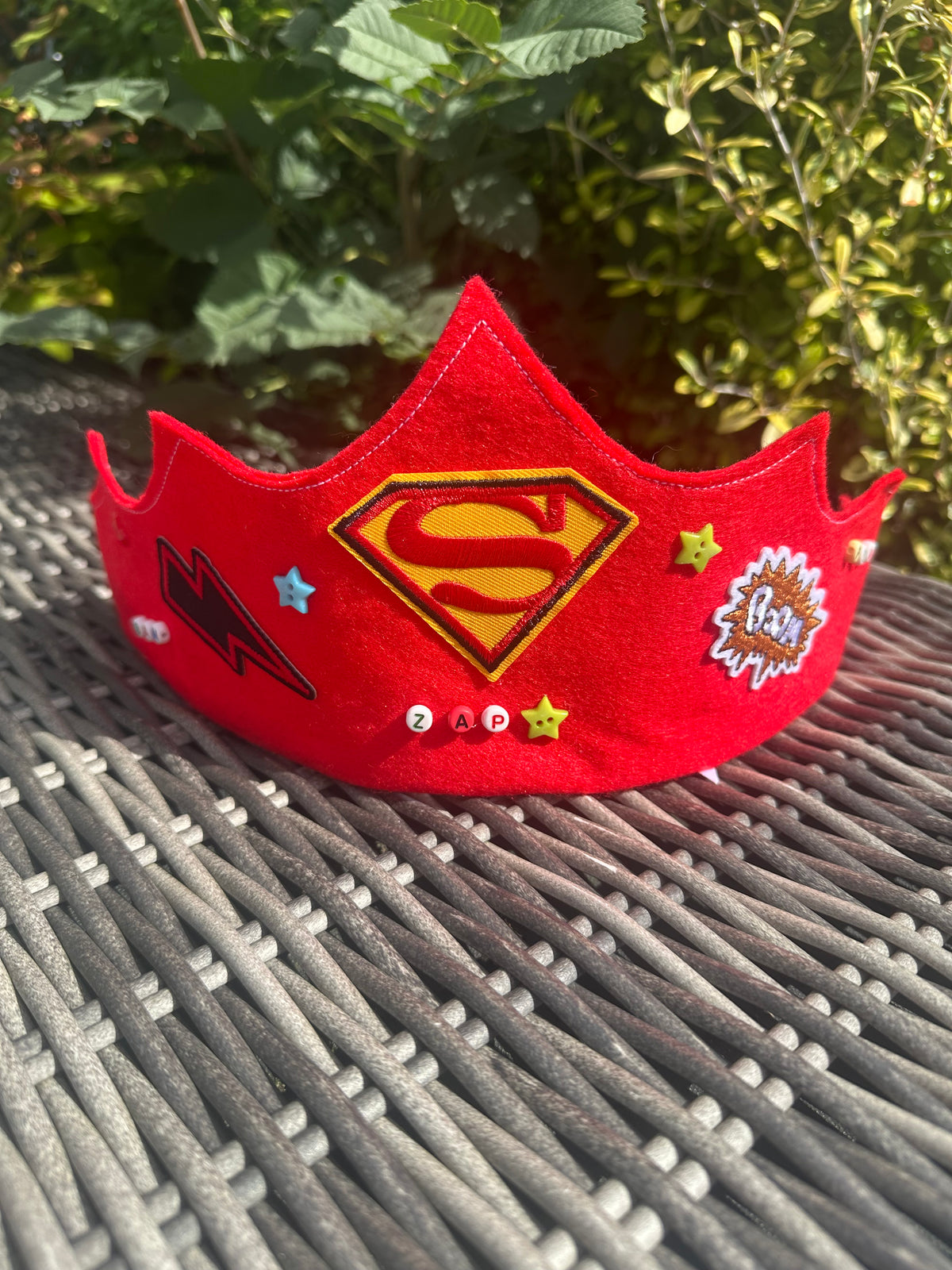 Red felt superhero crown with Superman logo, lightning bolt patch, star buttons and ZAP bead lettering